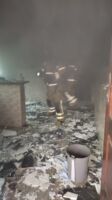 Mulher é resgatada com vida após incêndio em residência em Lafaiete